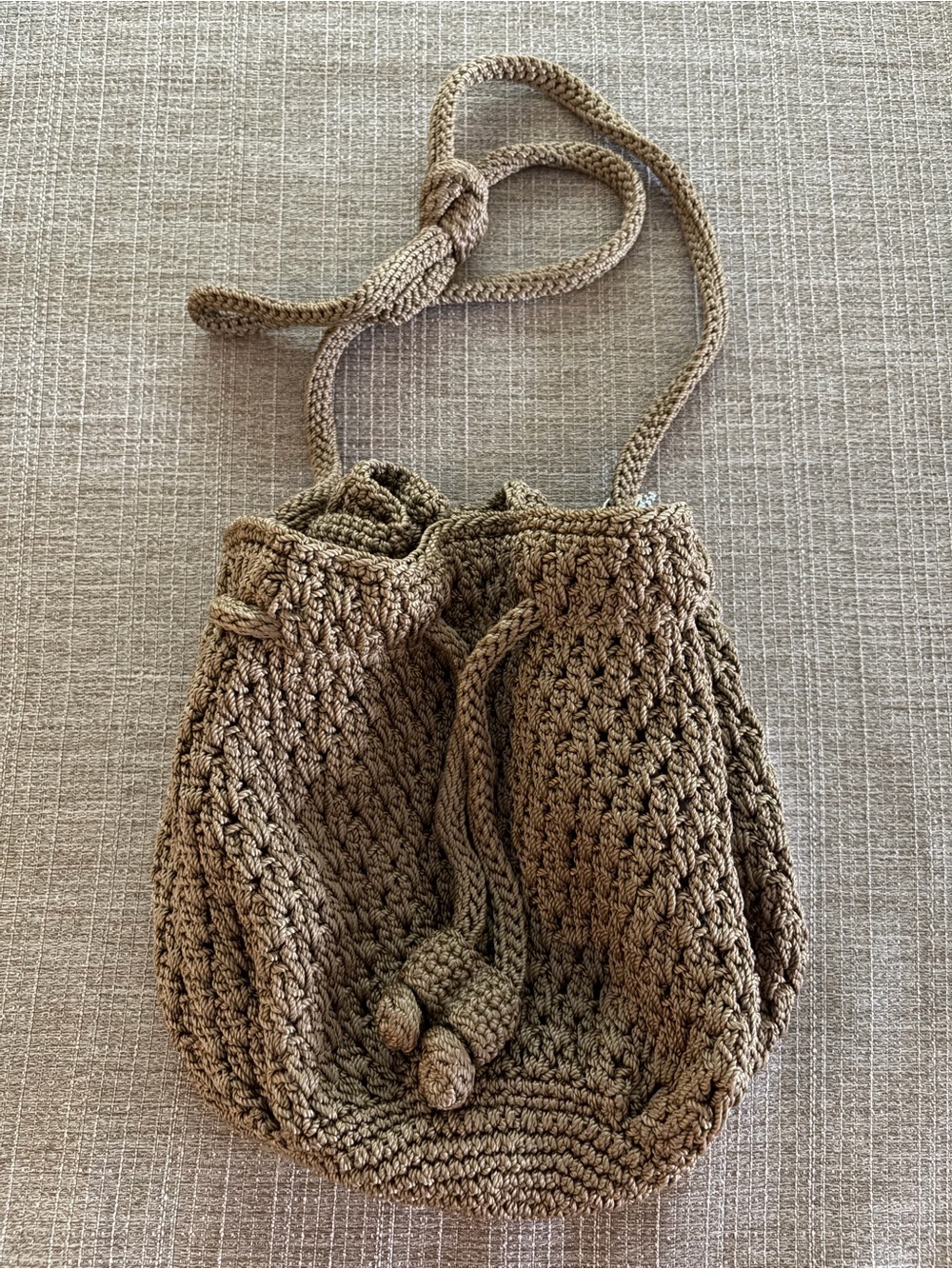 The Sak Crochet Drawstring Crossbody Bag in Brown